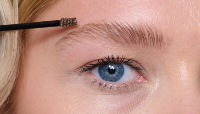 Model applying brow product
